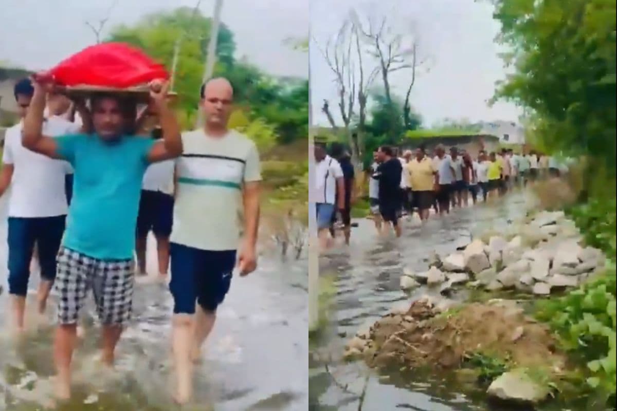 कंधे पर शव, घुटनों तक पानी, शव यात्रा बनी संघर्ष की कहानी, देखें वीडियो